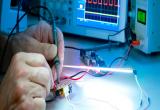 Image of technician working on circuit board