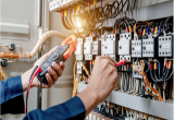 uses a multimeter to test the electrical installation and power line current in an electrical system 