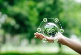 Hand-holding crystal globe with icon circular economy
